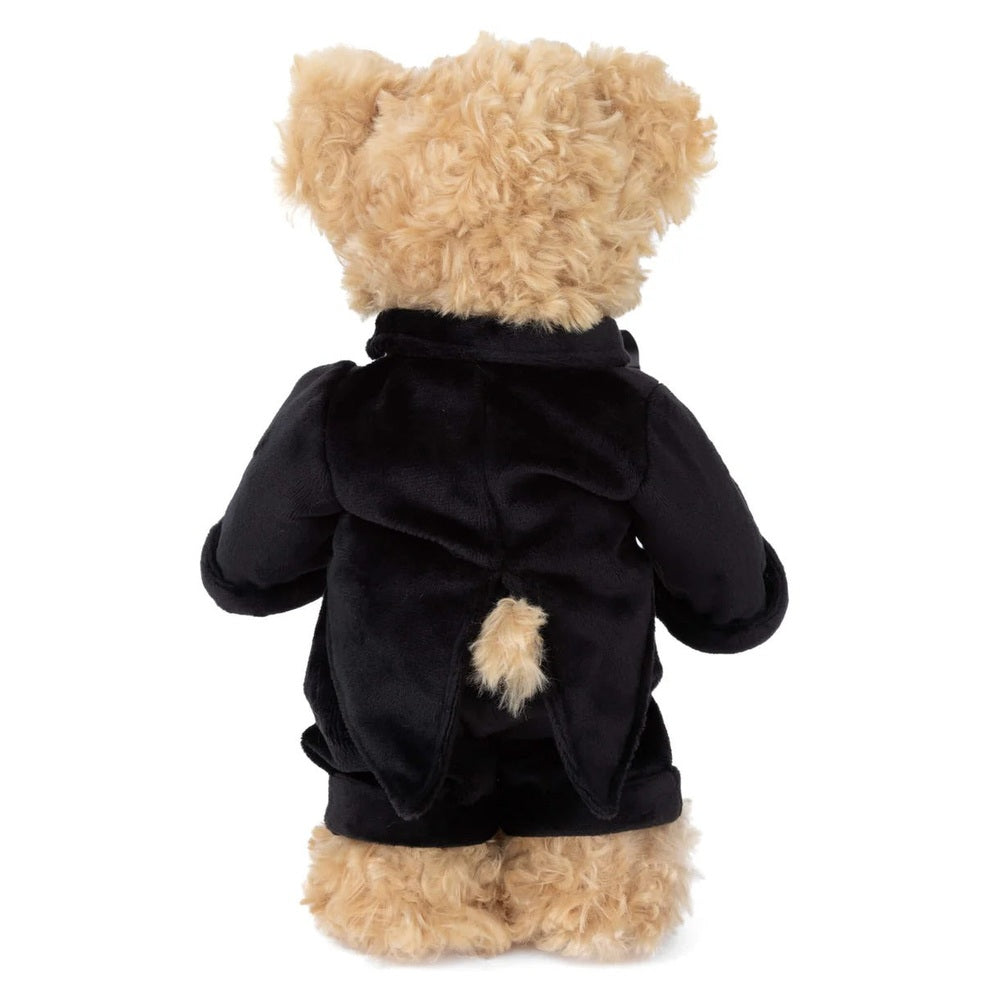 Bukowski Bears Groom plush teddy wearing a black coat with fluffy beige fur tail, back view.