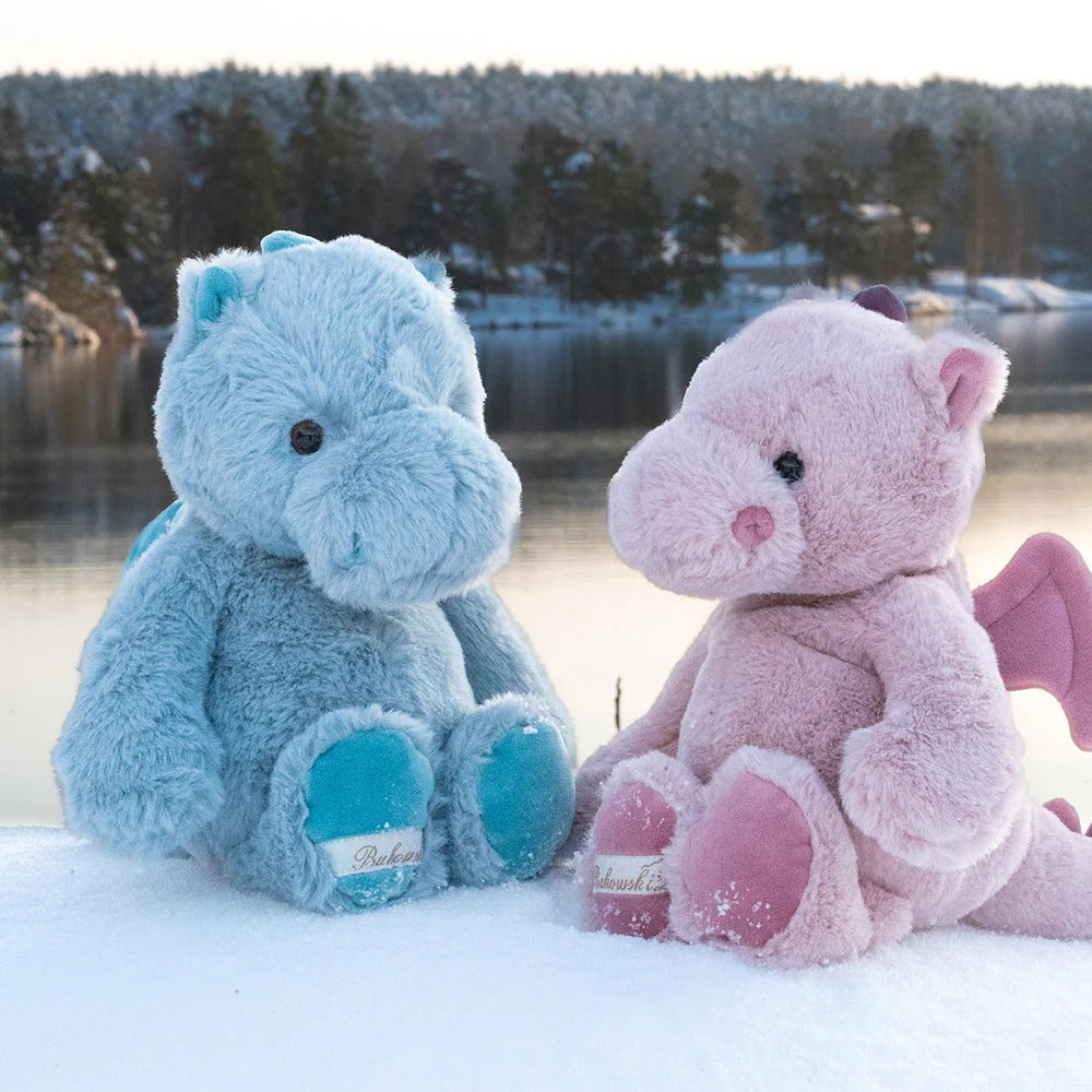 Bukowski Bears Lovely Drago - Sapphire plush dragon, blue and pink, sitting on snow beside a lake.