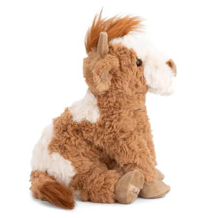 Bukowski Bears Madison the Highland Cow plush toy, brown and white fur with horns, sitting upright.