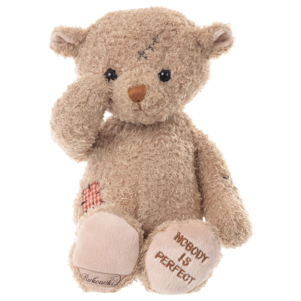 Bukowski Bears Nobody is Perfect stuffed bear, beige plush with paw patch, sits with paw to head and embroidered sole saying Nobody is Perfect.