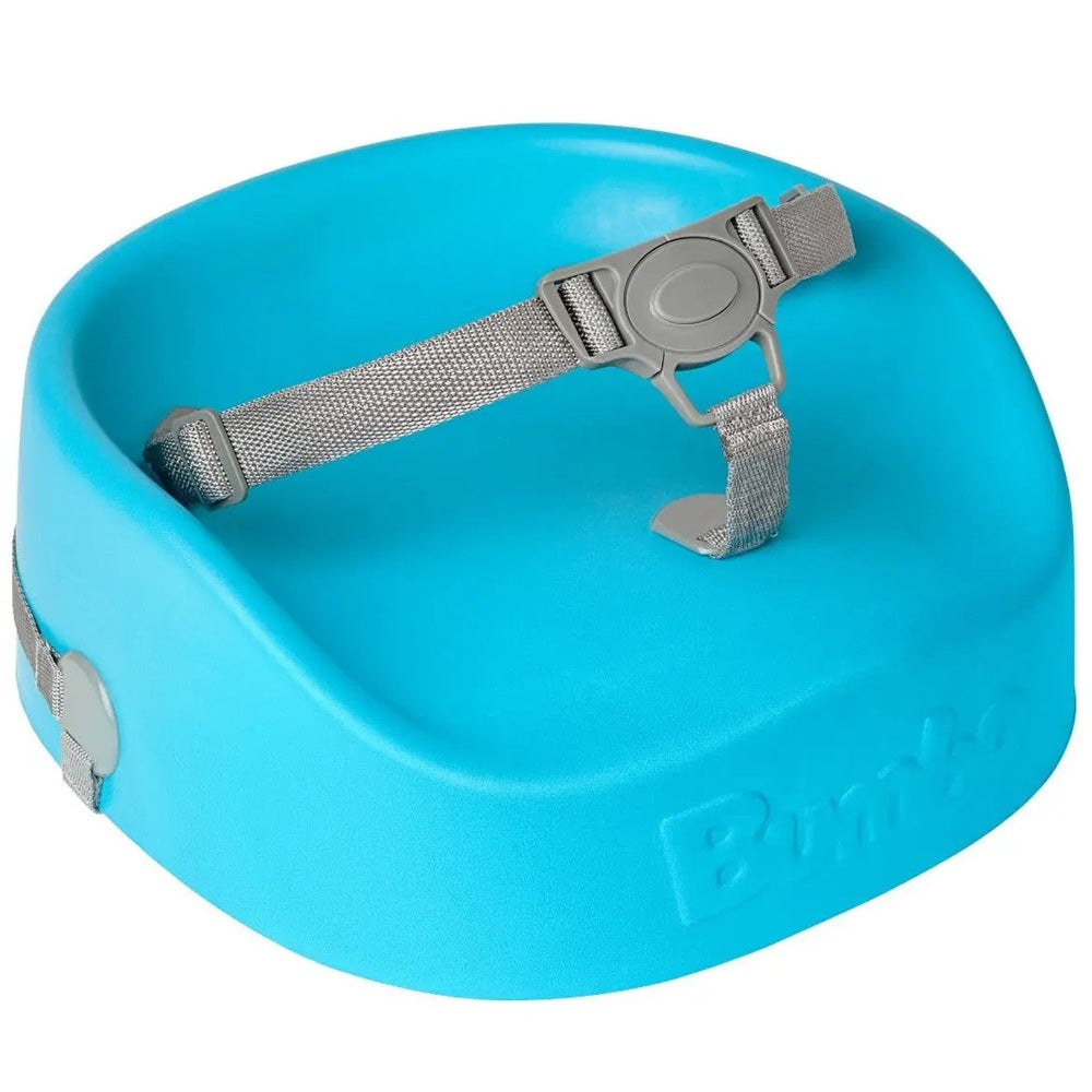 Bumbo Booster Seat blue with adjustable gray safety strap buckled for secure seating.