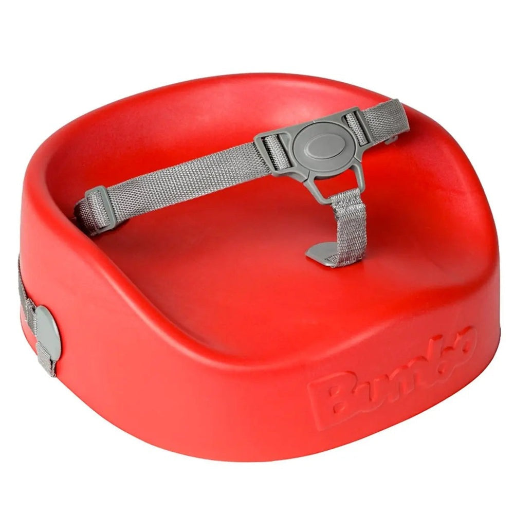 Bumbo Booster Seat red plastic baby chair with adjustable grey safety strap fastened across the seat