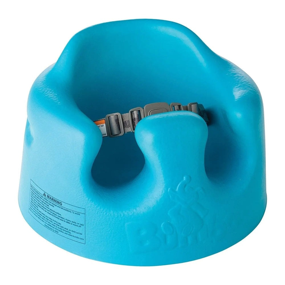 Bumbo Floor Seat, blue baby booster with adjustable gray safety belt securing a child.