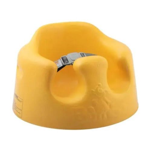 Bumbo Floor Seat yellow foam with a gray adjustable strap, ready to support a baby sitting securely.
