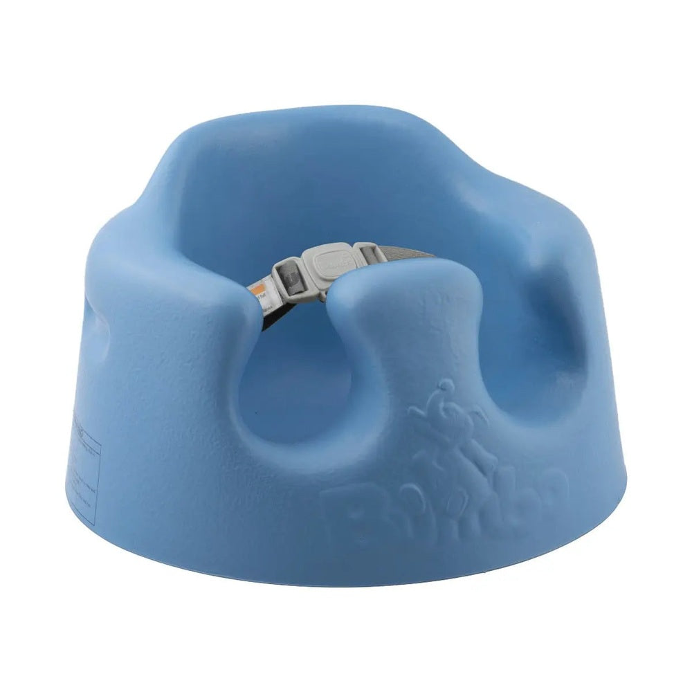 Bumbo Floor Seat blue with buckled adjustable safety belt securing a snug baby seating moment.