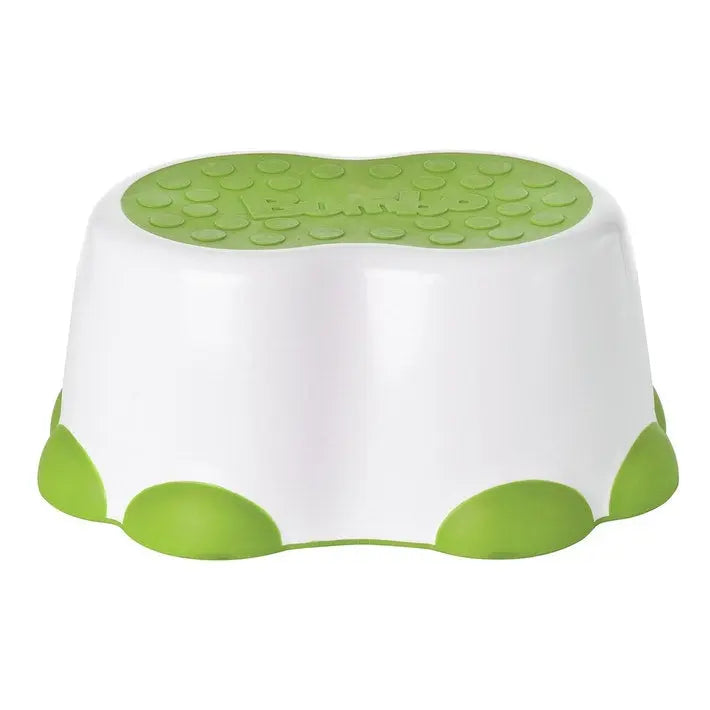 Bumbo Step Stool white with green non-slip top and leaf-accent base, ready for toddler use.