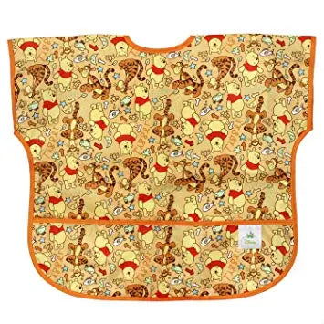 BUMKINS Bumkins Junior Bib Disney laid flat, showing orange trim and Pooh-print fabric.