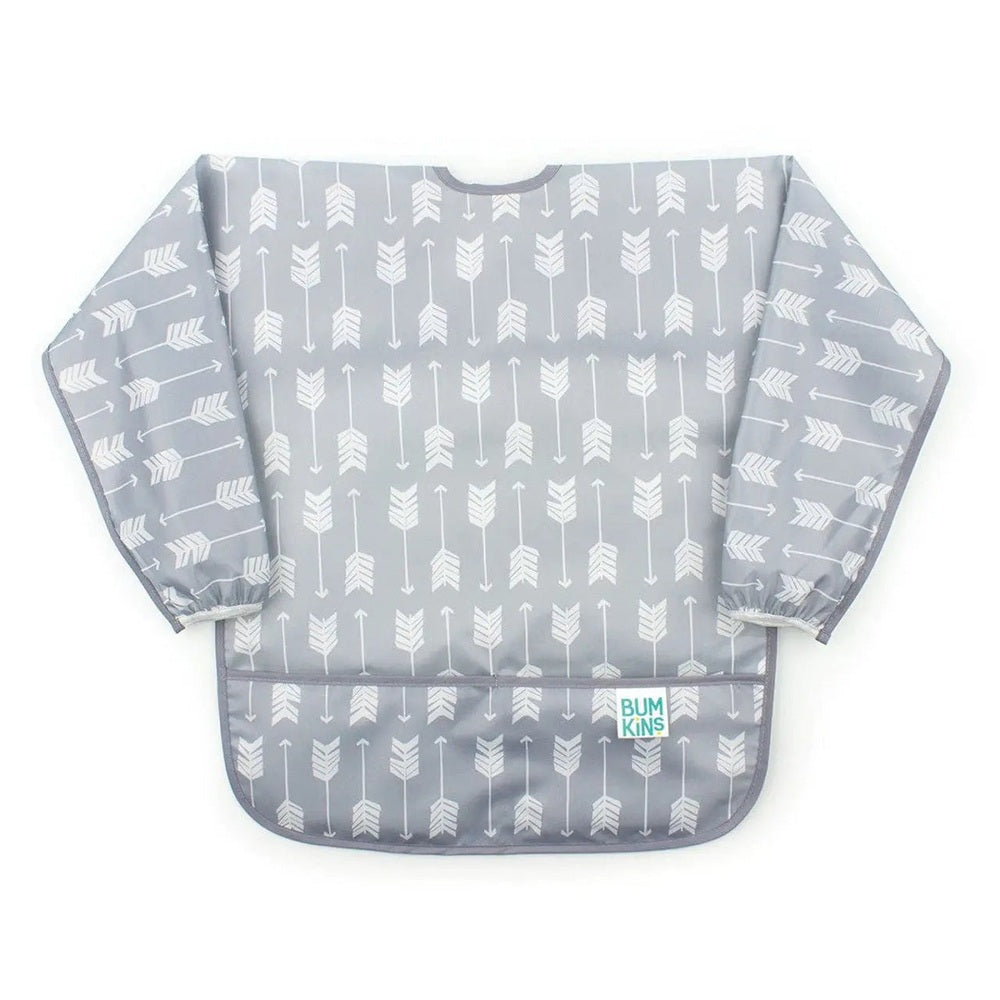 Bumkins Long Sleeved Smock Bib in grey with white arrows, full-coverage feeding protection shown laid flat.