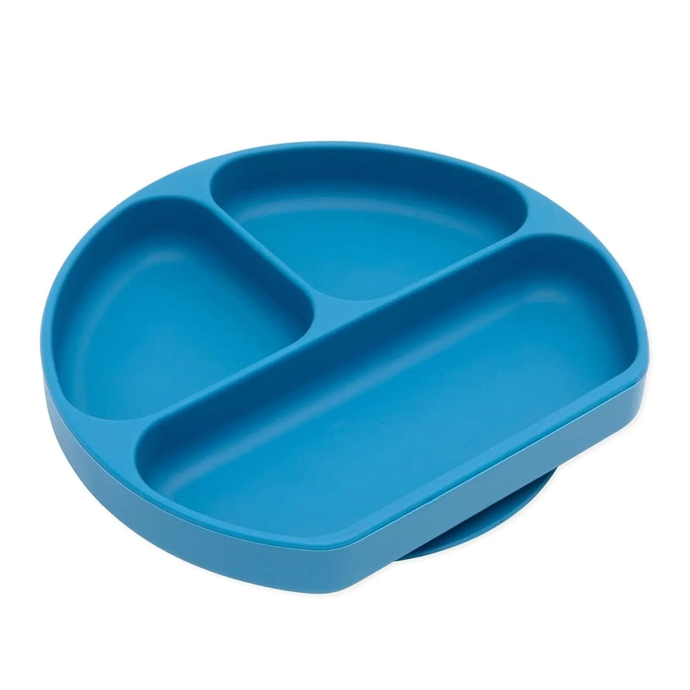 Bumkins Silicone Grip Dish blue three-compartment plate with non-slip grip kept steady on the table as baby eats.