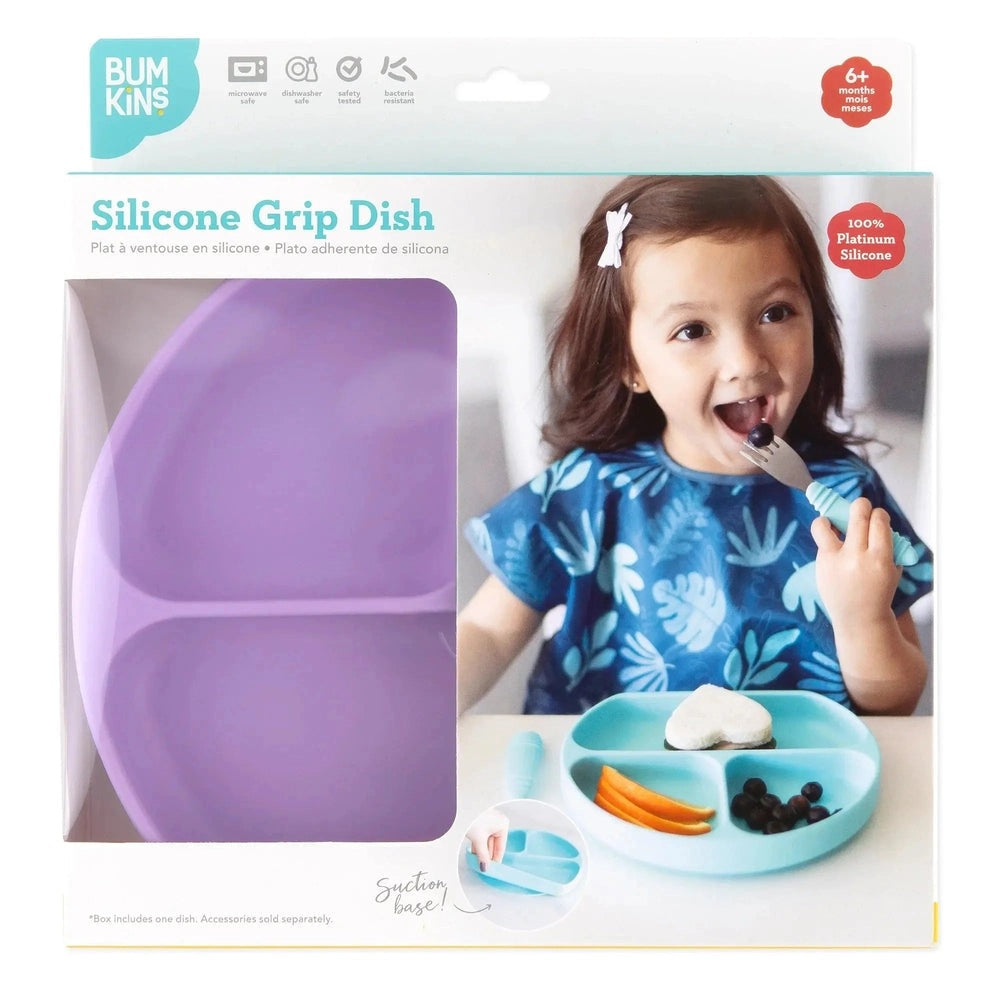 Bumkins Silicone Grip Dish, purple divided plate with suction base, toddler uses a fork to eat blueberries.