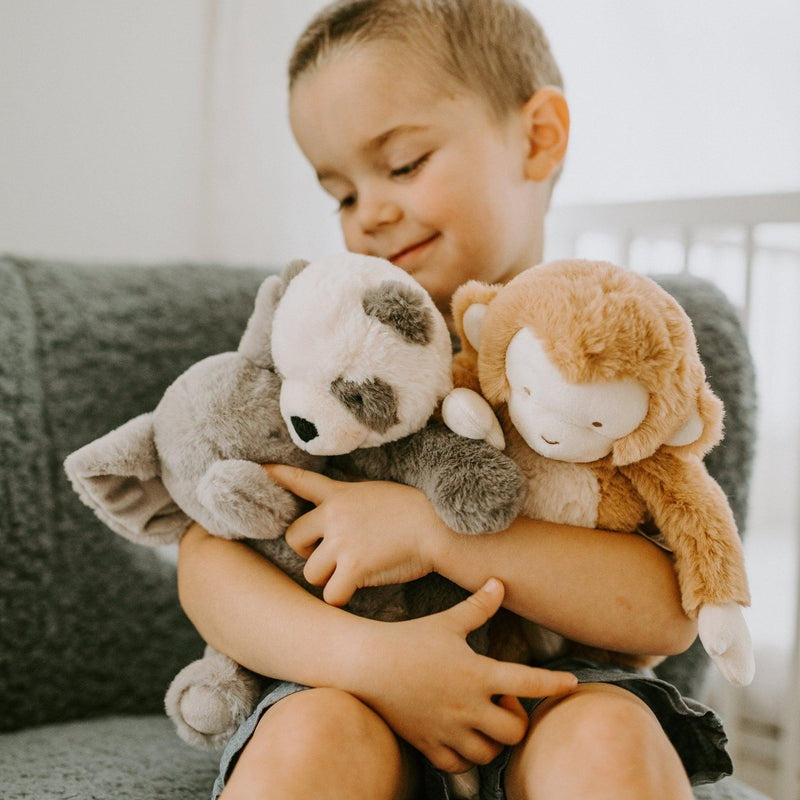 Bunnies By The Bay Tiny Nibble Bananas monkey and panda plush toys (2) held by a child