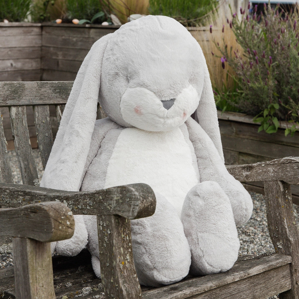 Bunnies by the Bay Grand Nibble Bunny 41-inch gray plush stuffed animal seated on a weathered wooden bench