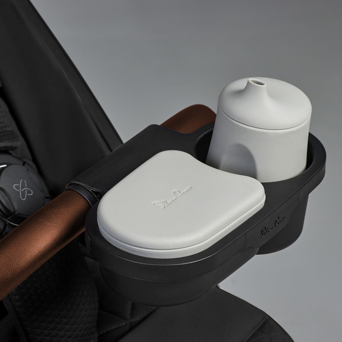 Silver Cross Clic stroller in Space with optional Snack Tray shown; accessory sold separately