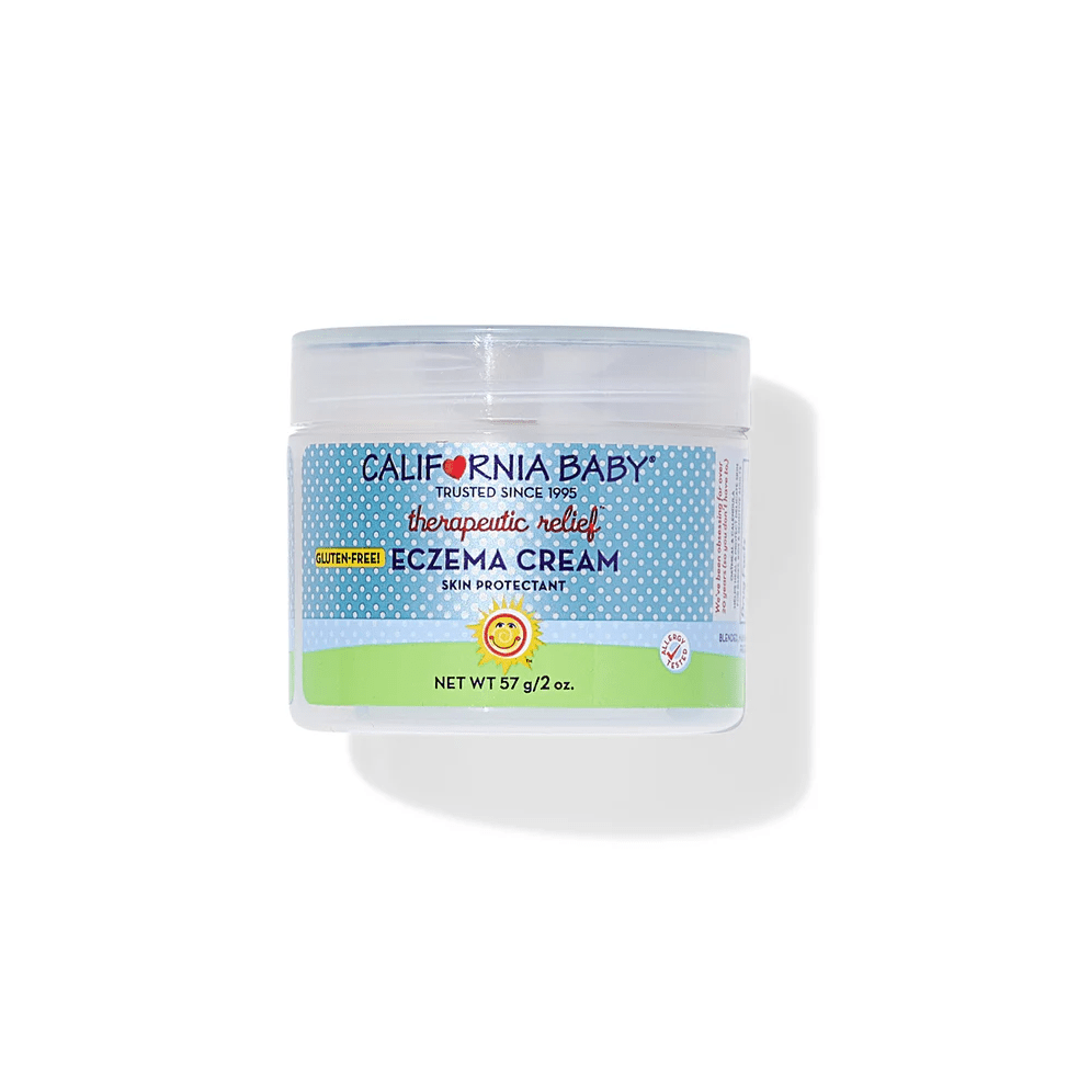 California Baby Eczema Cream jar with blue dotted label and skin protectant badge, 57 g, resting on white surface.