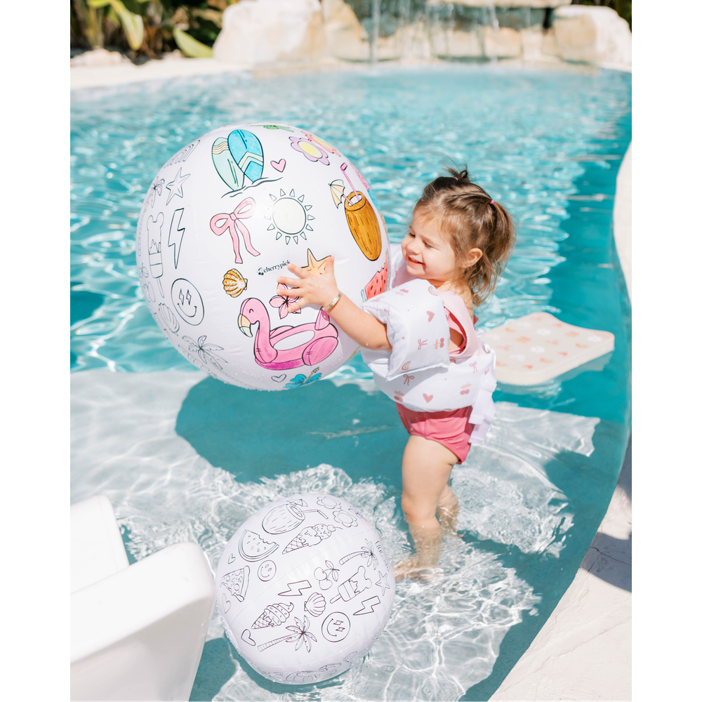 Cherrypick Design Your Own Beach Ball Kit child playing in pool