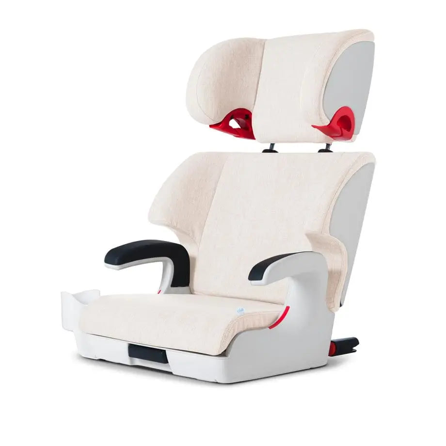 Clek Boost Seat Oobr booster in beige fabric with gray sides; red belt guides and sturdy black armrests visible.