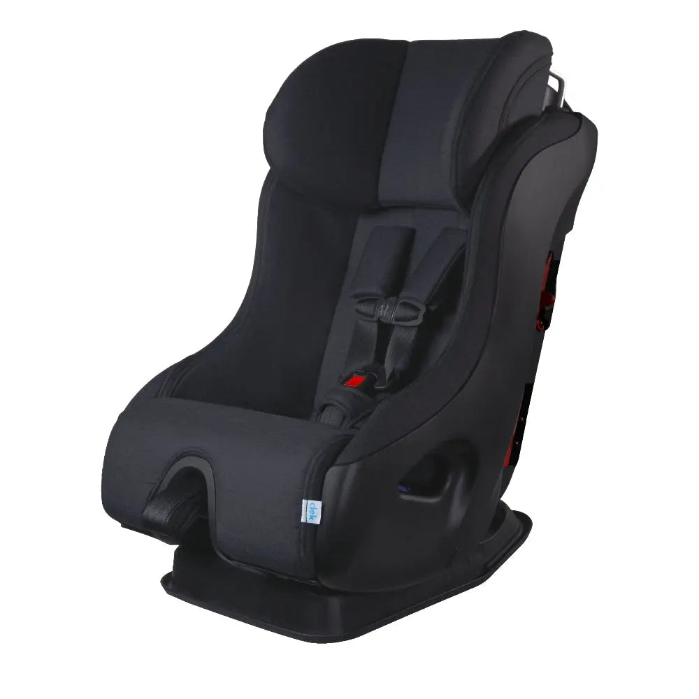 Clek Fllo convertible car seat in black with 5-point harness, showing secure straps ready for use.