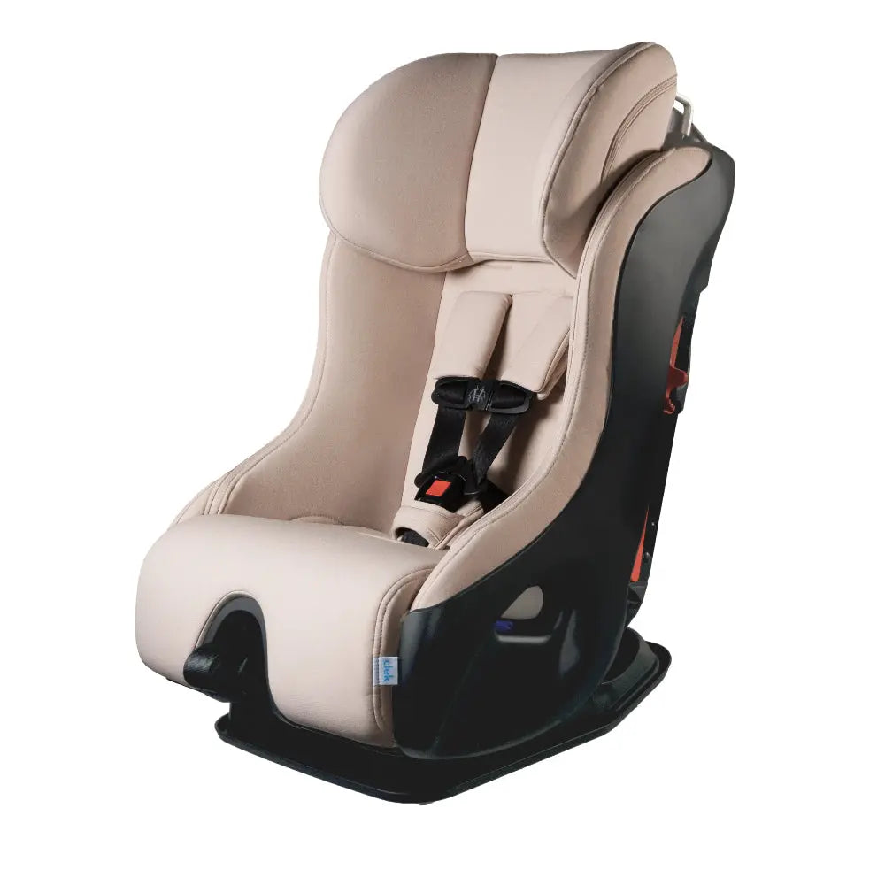 Clek Convertible Car Seat Fllo in beige fabric with black shell, showing a buckled 5-point harness.