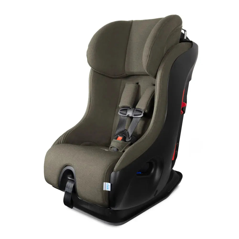 Clek Fllo convertible car seat in olive-green fabric with a buckled 5-point harness.