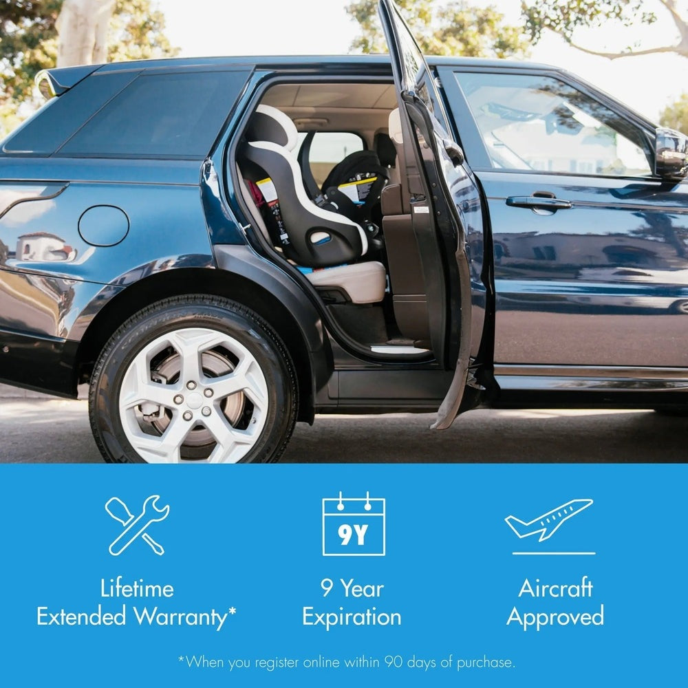 Clek Foonf convertible car seat in gray with white trim secured in the back seat of a blue SUV, door open.