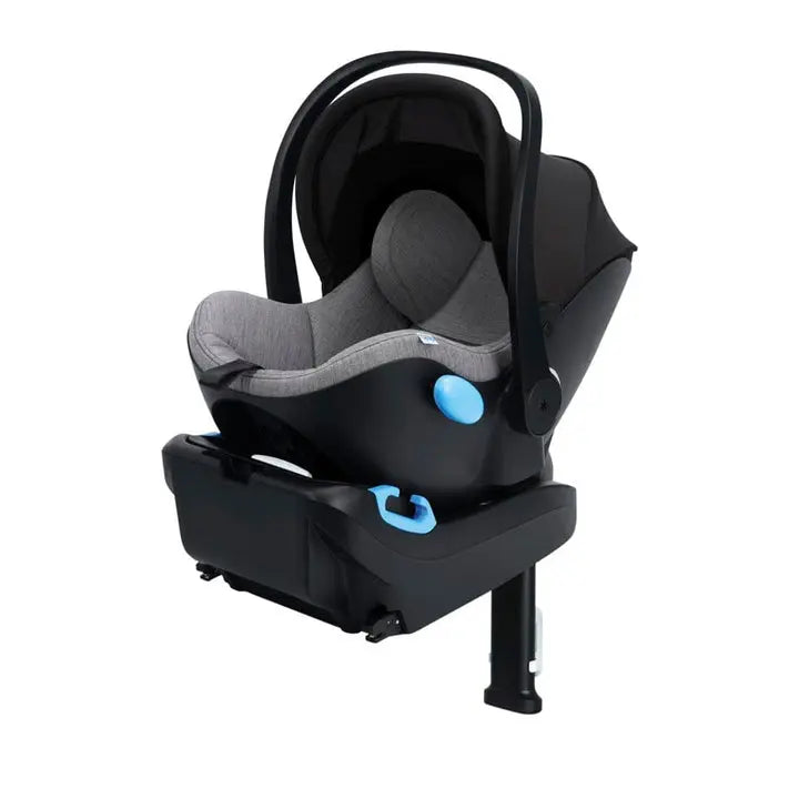 Clek Liing infant car seat in black shell with grey cushioned interior, base attached and leg extended.