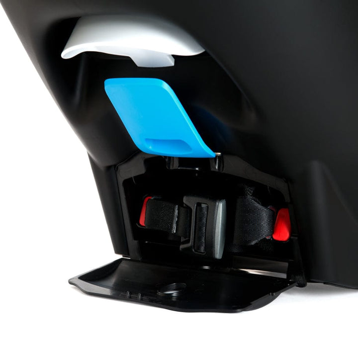 Clek Liingo Railroad infant car seat base with blue shield, black shell and red buckles.