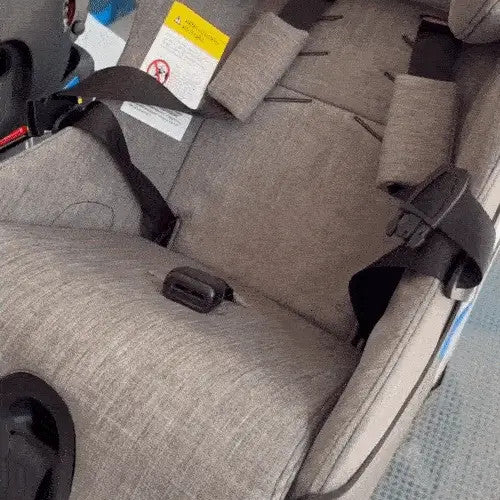Clek P-Thingy Railroad gray fabric car seat accessory installed in a baby car seat
