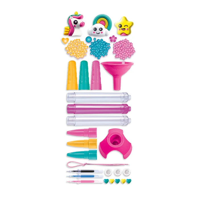 Clementoni Create Your Pens Fantasy kit with colorful pens, beads, and shapes laid out for kid crafts