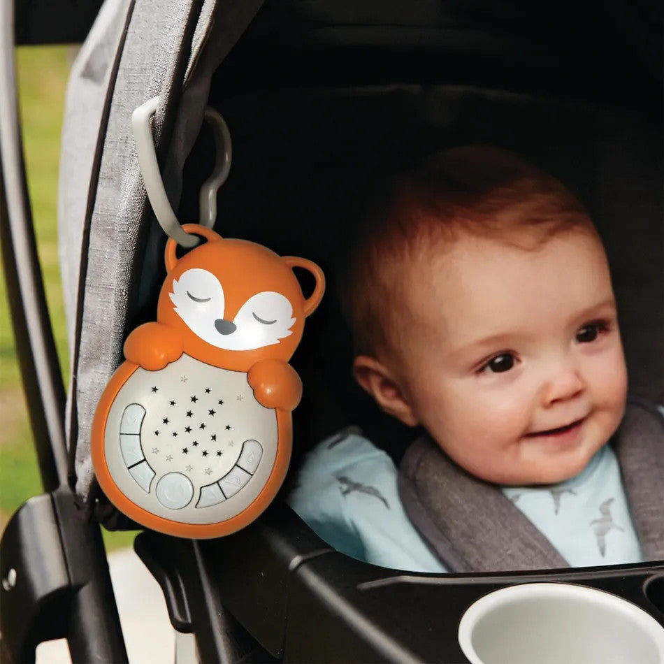 Cloud B Sweet Dreamz On The Go Fox clip-on night light, orange fox design with starry panel, attached to stroller.