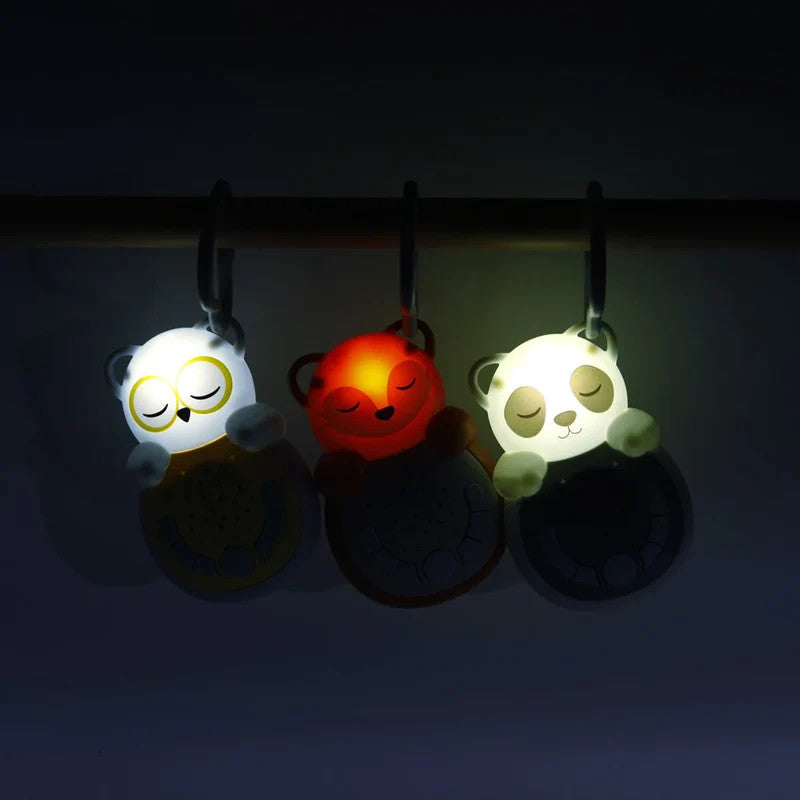 Cloud B Sweet Dreamz On The Go Fox nightlight plush clips, three foxes in white, orange, and white