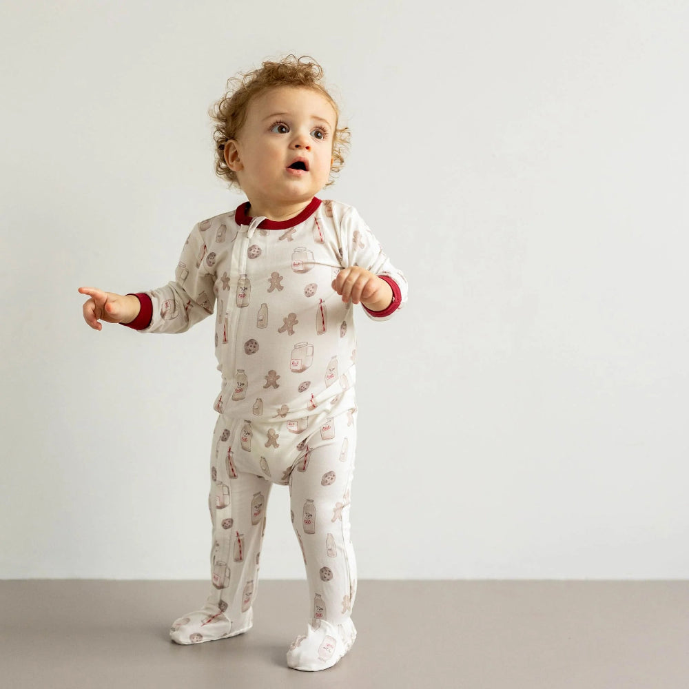 Coccoli infant zipper footie in white with red trim and cookies print; cotton TENCEL Modal baby onesie