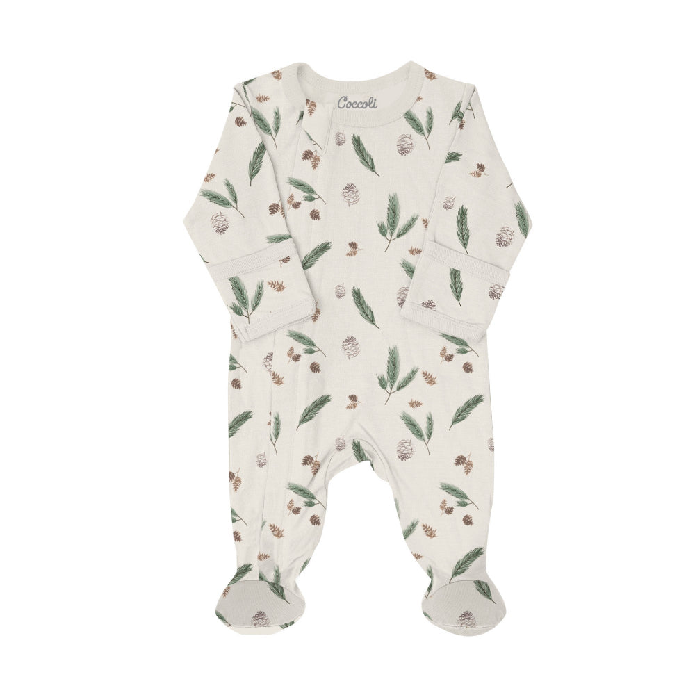 Coccoli infant footed sleeper in oat milk with pine cone leaf print; cotton TENCEL Modal fabric and zipper