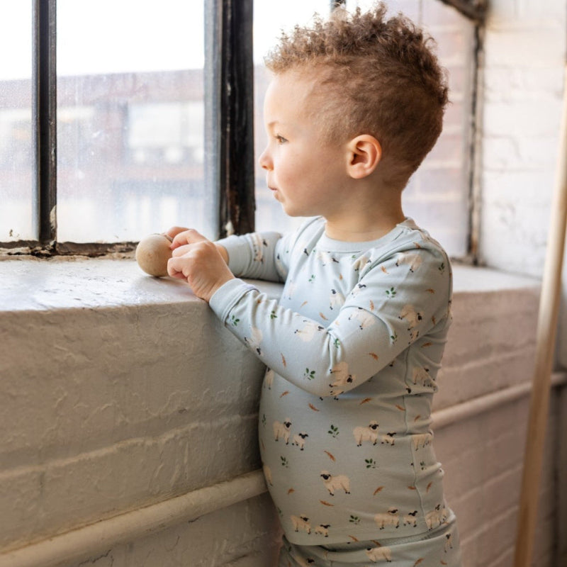 COCCOLI kid long-sleeve pajama onesie in light blue with sheep print, cotton TENCEL™ Modal blend