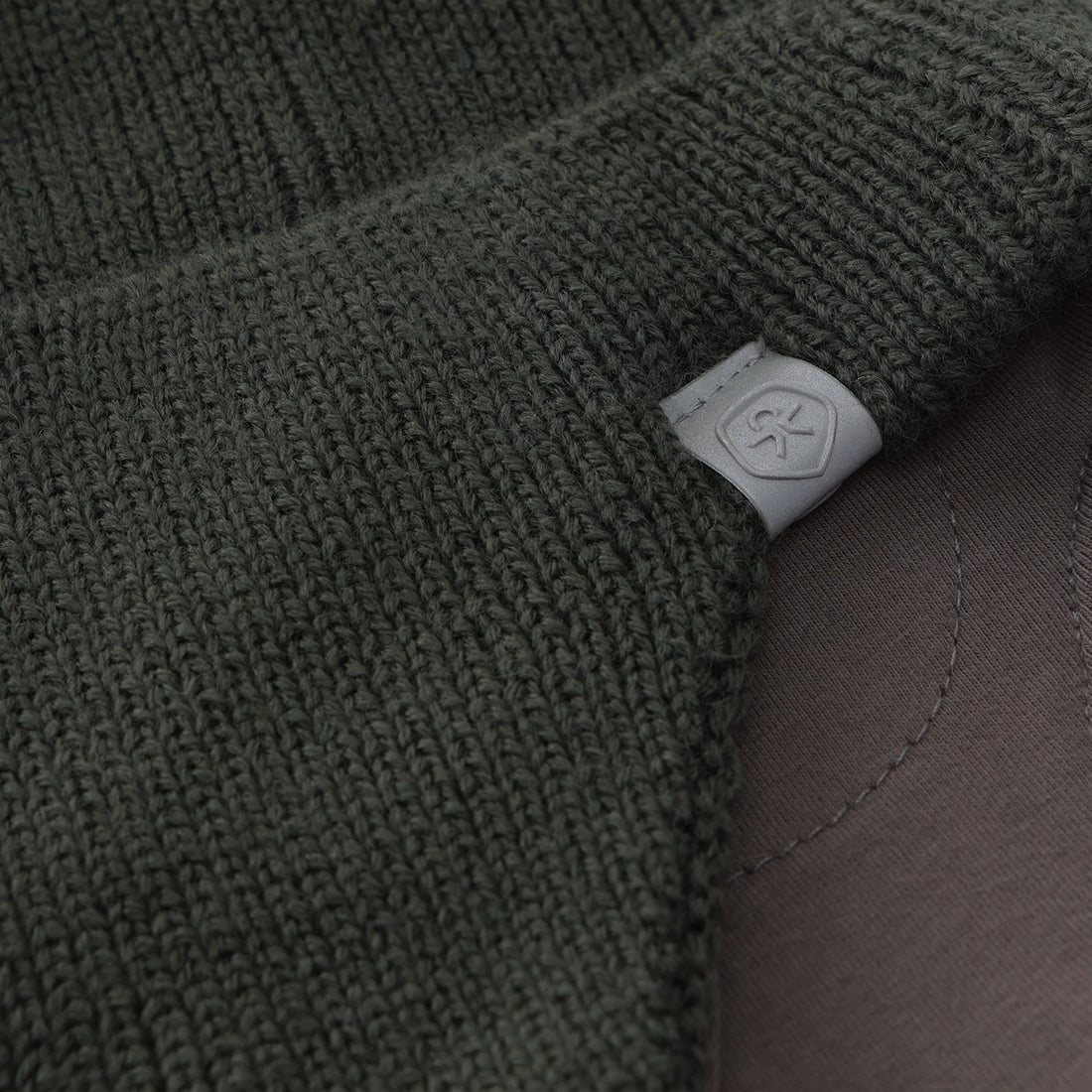 Color Kids 550480 baby hat in Kambaba (9404), close-up of knit texture, logo patch and lining