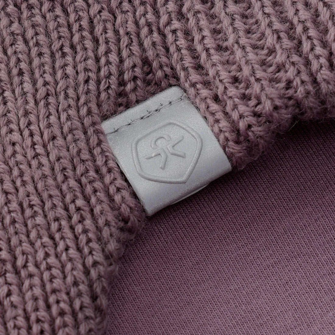 Color Kids 550480 baby hat in Toadstool (6011), close-up of knit texture, logo patch and lining