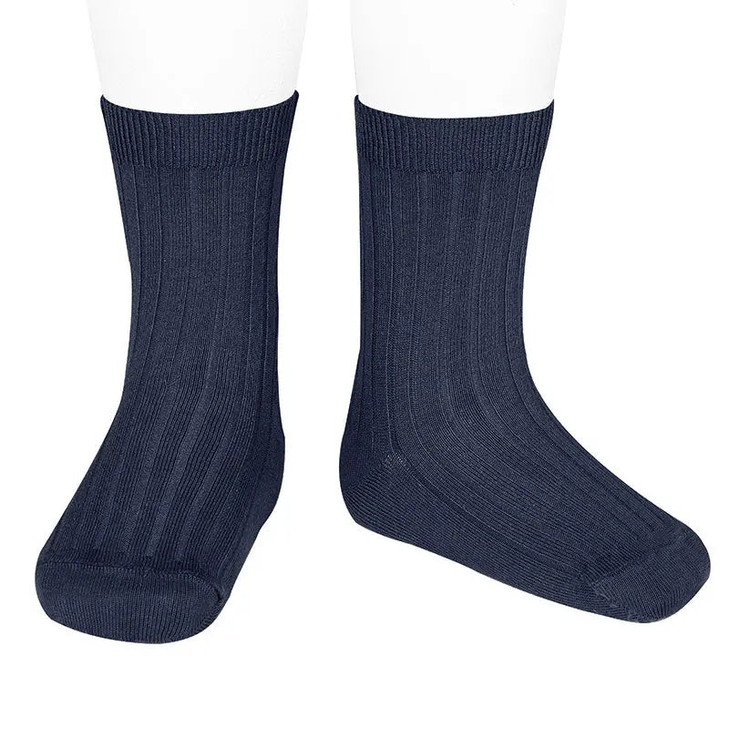 Condor Basic Short Socks Navy Blue pair on feet, ribbed crew-length athletic socks showcasing stretch and fit.