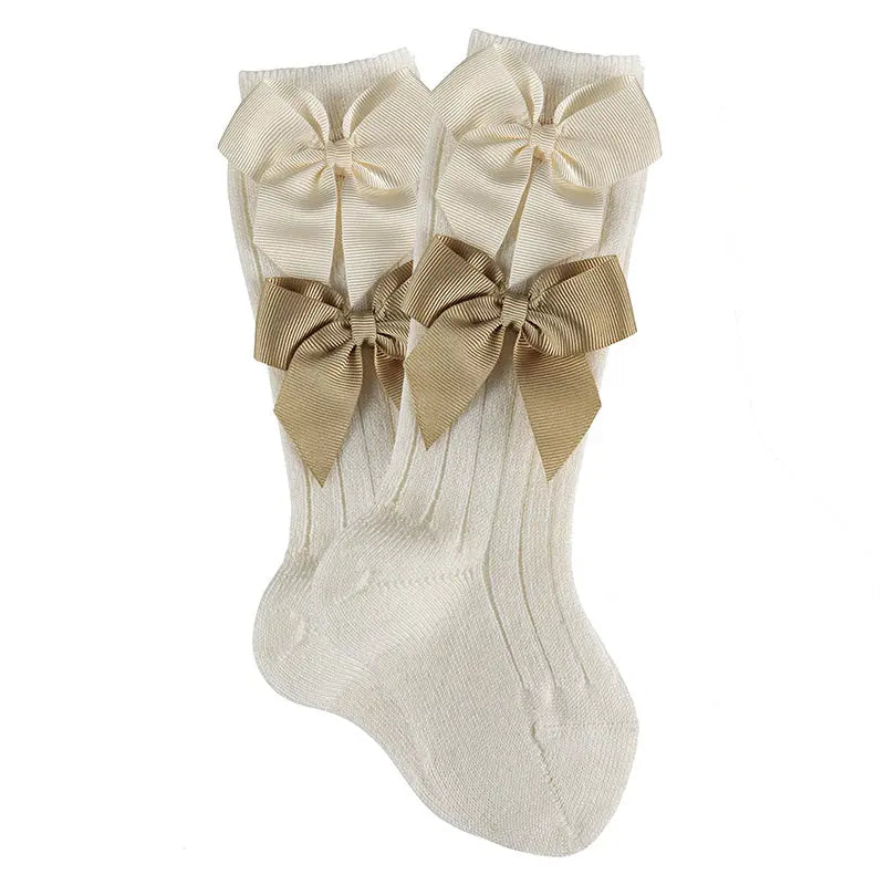 Condor Merino Wool Blend Knee Socks with two beige grosgrain bows, cream knee-highs displayed as a pair.