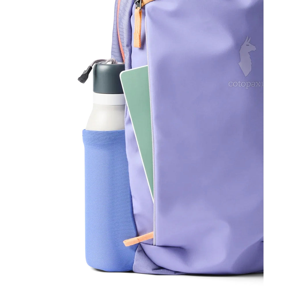 Cotopaxi Allpa 18L Daypack in Lavender with blue side water bottle pocket.