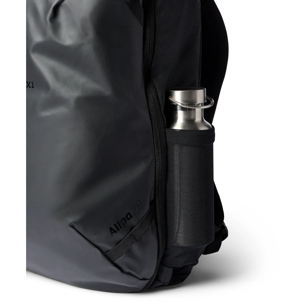 Cotopaxi Allpa 28L Travel Pack in Charcoal Gray with side water bottle pocket.