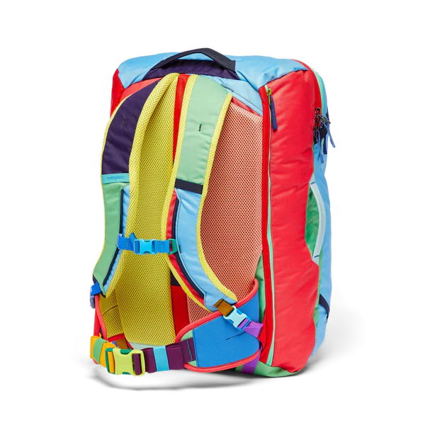 Cotopaxi Allpa 42L Travel Pack in rainbow color-block with yellow padded shoulder straps, blue accents, side view.