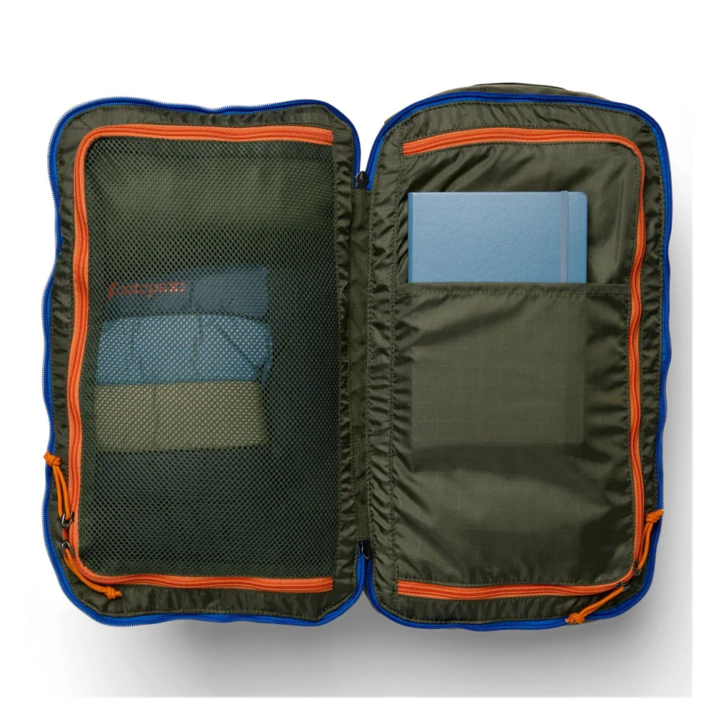 Cotopaxi Allpa Mini 20L Travel Pack in Olive Green with orange zippers and blue trim, open with mesh left pocket.