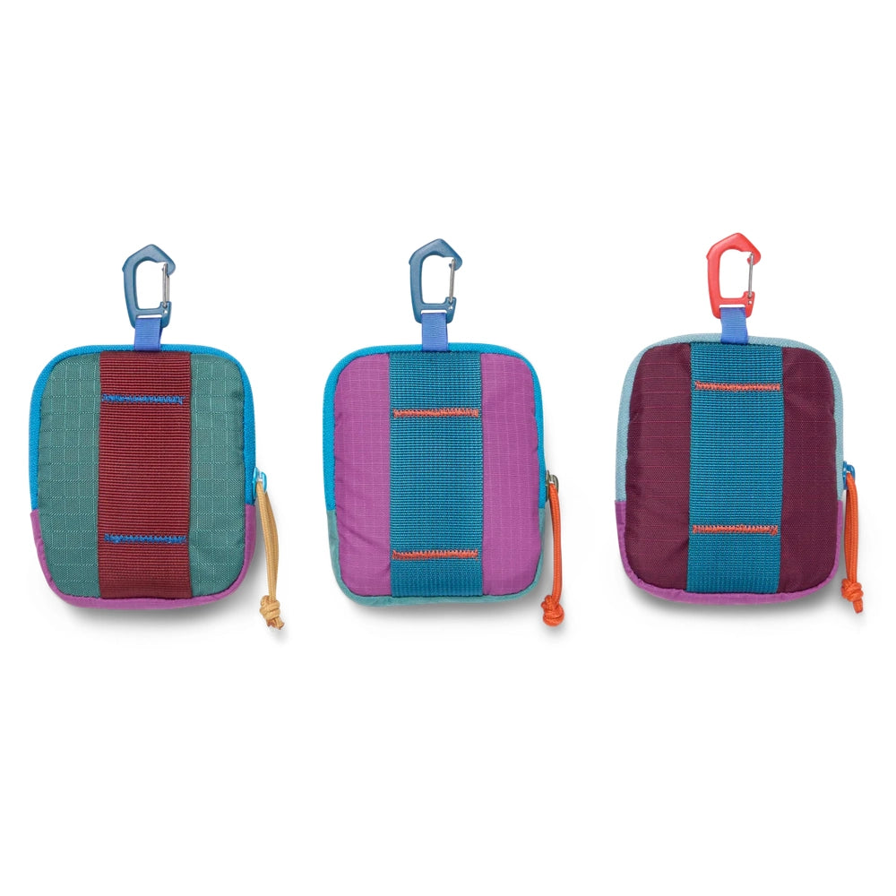 Cotopaxi Allpita Mini Bag in teal, purple, and burgundy colorways with turquoise straps and clip-on carabiners.