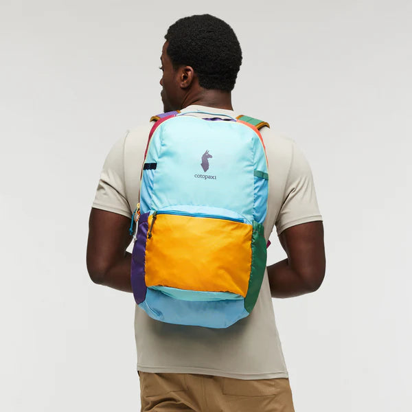 Cotopaxi Chiquillo 26L Daypack in turquoise with orange front pocket and purple side pocket