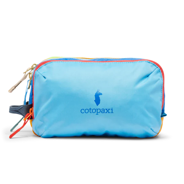 Cotopaxi Nido Accessory Bag in Light Blue with multicolor zippers and logo on front.