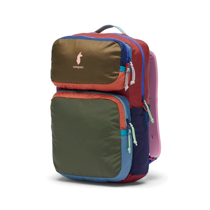 Cotopaxi Tasra 16L Backpack in multicolor block design with olive front pocket, brown top panel, red body, blue zippers.