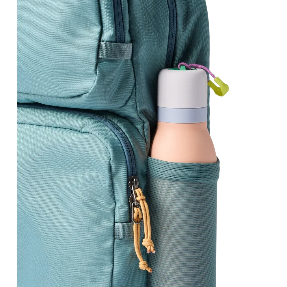 Cotopaxi Tasra 16L Daypack in Teal with water bottle in side pocket