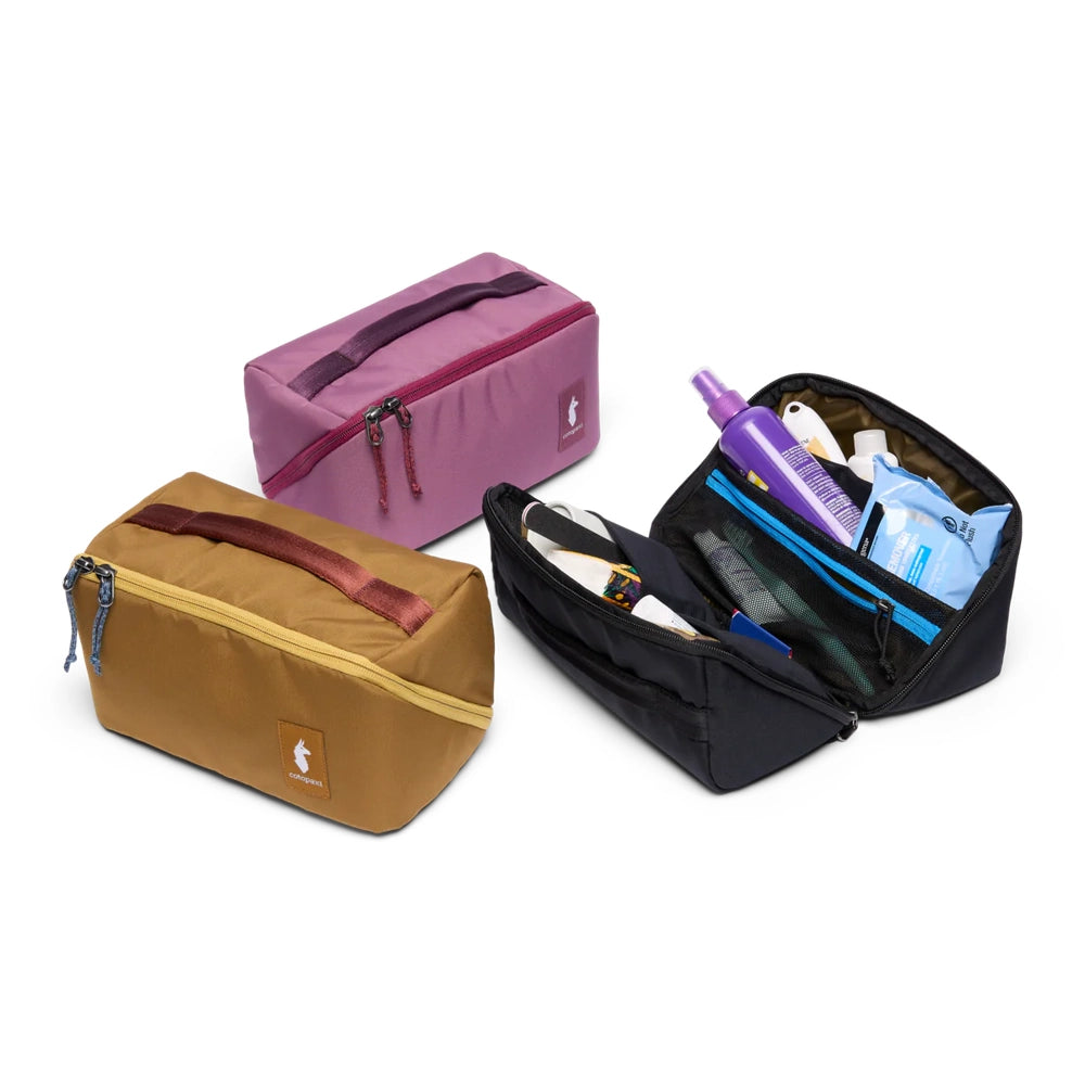 Cotopaxi Travel Toiletry Kit in Lavender and Mustard with Black open kit showing compartments