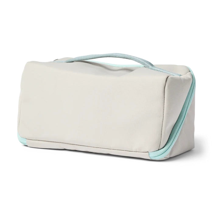 Cotopaxi Travel Toiletry Kit Toiletry Bag in Cream with turquoise trim
