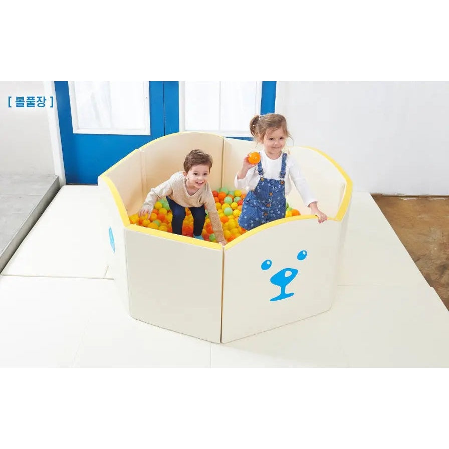 Creamhaus Grand Ice Castle Up Bt ball pit in cream with yellow edges; two kids play among colorful balls.