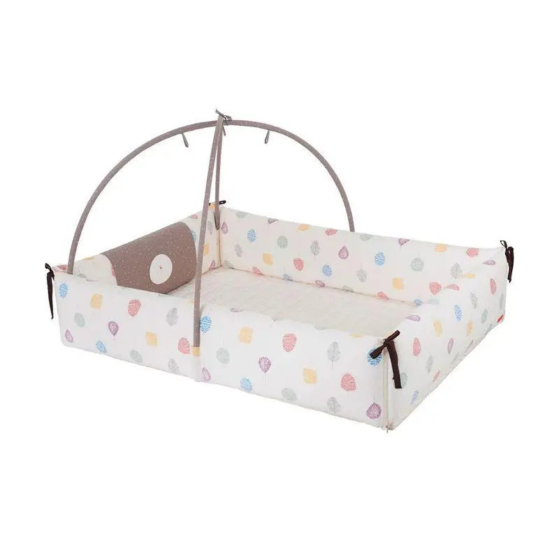 Creamhaus Inua Bumper Bed Guard XL in cream with pastel print; toddler bed bumper with fabric arch and ties.